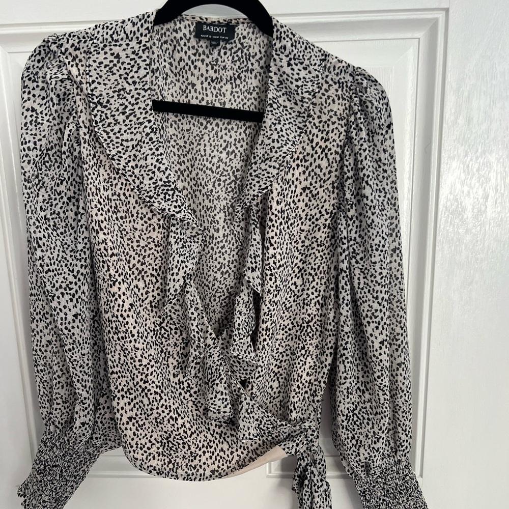 Wrap blouse, ruffle detail.